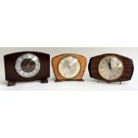 Three clockwork mantle clocks