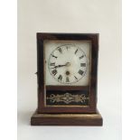 Small American mantel clock with key and pendulum,