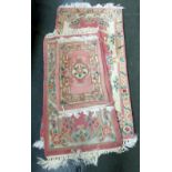 Three small Chinese wool carpets, 47x78cm, 64x73cm,