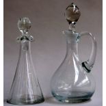 A conical handblown glass vinegar bottle, and a small glass oil jug,