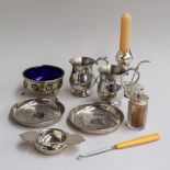 Two small pewter tankards, two small trays with foliate decoration,