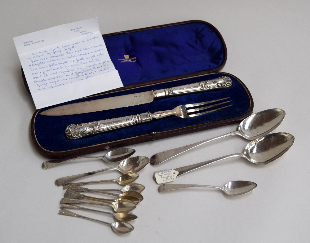 A large silver knife and fork made by George Angell in 1854-5, in blue velvet lined case,