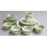 A Crown Staffordshire 'Green Dragon' part tea set, highlighted in gilt, consisting of 8 saucers,