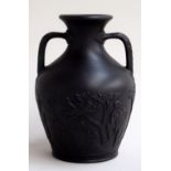 A 19th century Wedgwood black basalt miniature Portland vase,