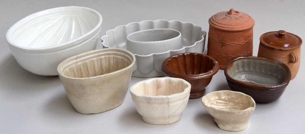 Seven jelly and tureen molds and two small terracotta pots