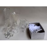 A selection of glass items including six champagne flutes, two cut glass vases, a cut glass jug,