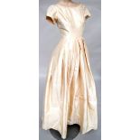 Exquisite dress of cream taffeta made in 1959 by Worth.