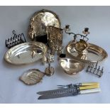 A mixed quantity of EPNS and plated ware and silver to include sugar tongs, salts with liners,