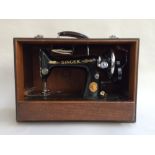 A 1938 Singer Sewing machine in box, with original manual, machine class 99K,