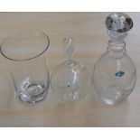 A selection of glass items including a decanter a vase and a glass ship in a bottle