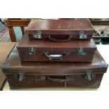 Three leather suitcases; one a Freemason's case, 46x21x7cm, one marked 'AM' to top, 51x31x13cmD,