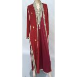 Sleeveless caftan tunic in heavy maroon synthetic jersey,