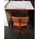 A modern child's desk with associated chair,