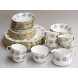 A large quantity of Minton 'Spring Bouquet' pattern fine bone china, highlighted in gilt,