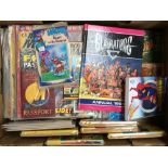 A box containing a mixture of children related annuals and comics