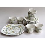 A Royal Doulton Tonkin part tea service comprising a set of six tea plates,