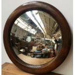 An Edwardian convex glass mahogany wall mirror, 65cmD,