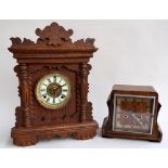 An Edwardian mantel clock made in England with pendulum and key together with an Ansonia Clock Co,