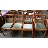 A set of eight pine chairs with drop in seats including two carvers