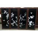 Four Chinese black lacquered panels with inlays depicting song birds and cherry blossom,