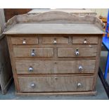 A Victorian stripped pine chest of drawers,