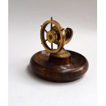 Maritime interest: a rosewood and brass nutcracker, the vice driven by a ships wheel,