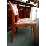 A set of four mid-century kitchen chairs upholstered in floral fabric