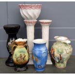 A pair of white ceramic urn stands, 50cmH, with one matching ceramic urn,