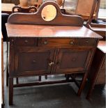 A side board with single drawer over cupboard doors,