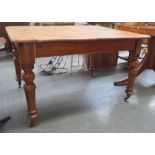 A Victorian pine plank top kitchen table on turned legs, 105.5x120.