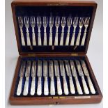 A Victorian canteen (with key) of flatware comprising twelve knives and forks with mother of pearl