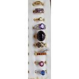 Nine 9ct gold rings with various gem stones and certificates of authenticity (9)