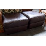 A pair of brown leather pouffs raised on square tapered feet,