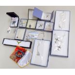 A number of silver necklaces and crucifixes including a rose quartz silver necklace and earrings