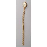 A 9ct gold ladies wrist watch, inscribed 'Geneve, gold' to face, which measures 15mm across,