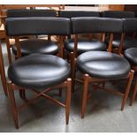 A set of four mid-century G Plan chairs with round leather seats and leather back,