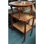 An oak two tier hostess or drinks trolley and a mahogany occasional table,