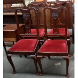 Four drop seat dining chairs upholstered in red velvet,