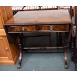 A sofa table with two frieze drawers, raised on swept legs and brass 'paw' casters, 86x56x77cmH,