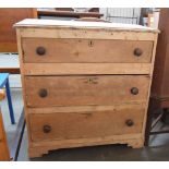 A Victorian stripped pine chest of drawers, three long drawers with wooden knobs, 48x94.