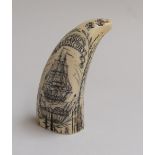 A 19th century Scrimshaw whale tooth,