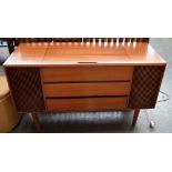 A mid-century sideboard stereo cabinet, containing a 'Solid State Stereo' turntable and speakers,