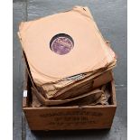 A wooden butter crate of 78s,