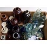 A quantity of vintage bottles and stoppers, of various sizes, one marked with tablespoon gradations,