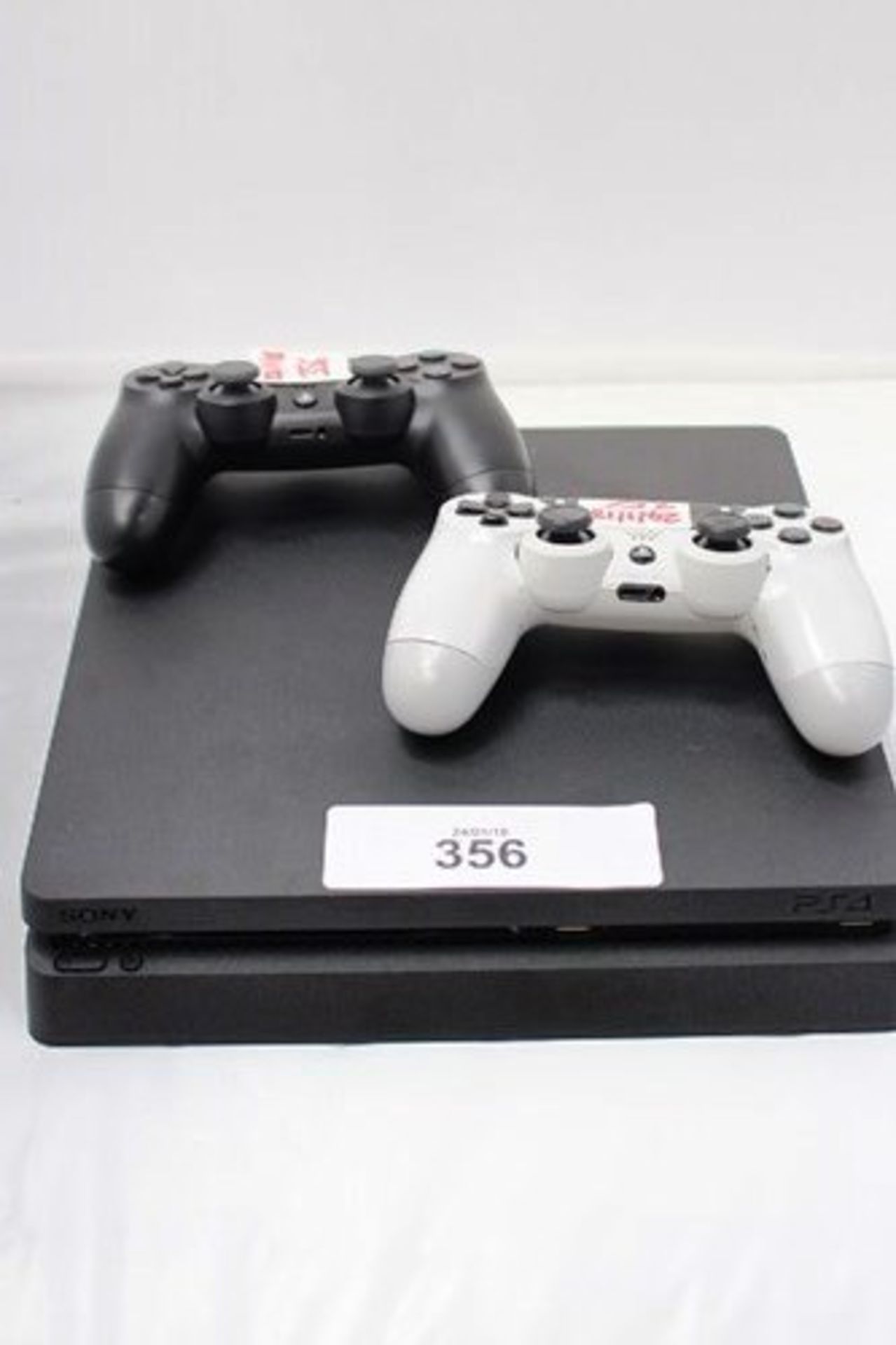 1 x Sony Playstation 4 with 1 x black and 1 x white controller - Used, powers on, untested, no power