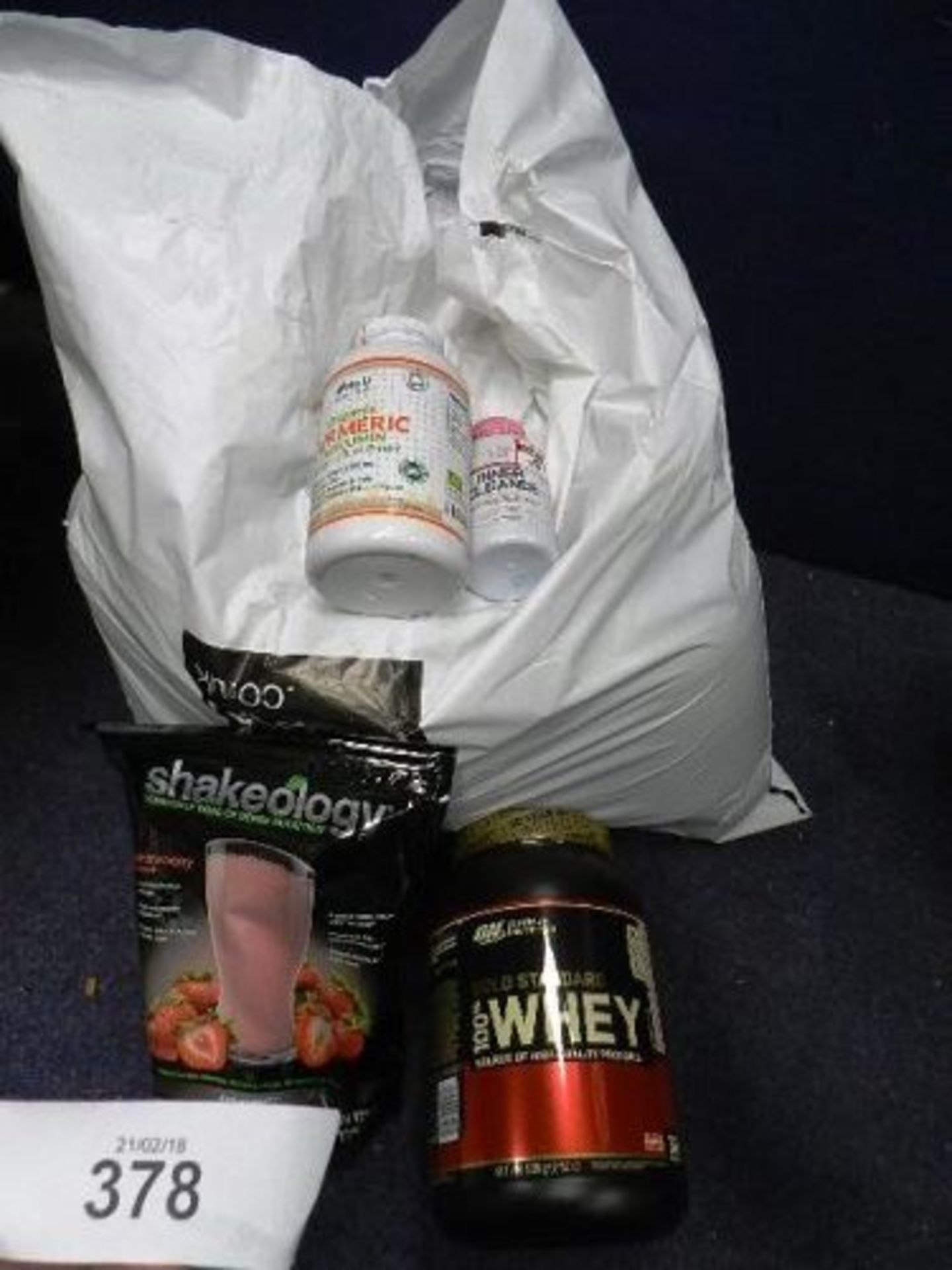 A sack of body building products including Beauty Body shakeology etc. (FSFloor)