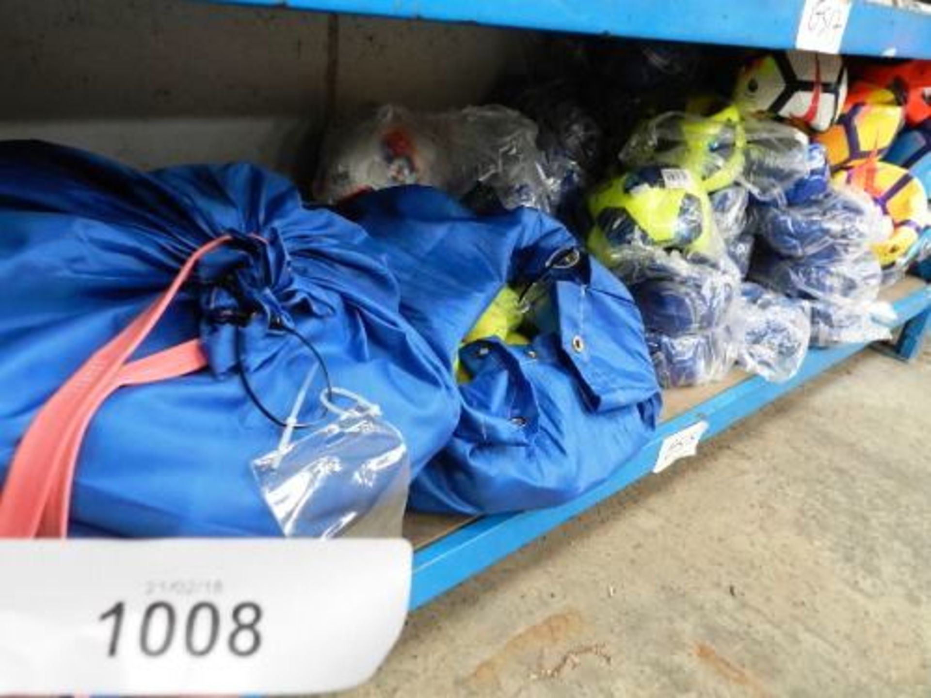A shelf of footballs, brands include Nike, Adidas and Splay, size 5 and 3and 2 x bags of tennis