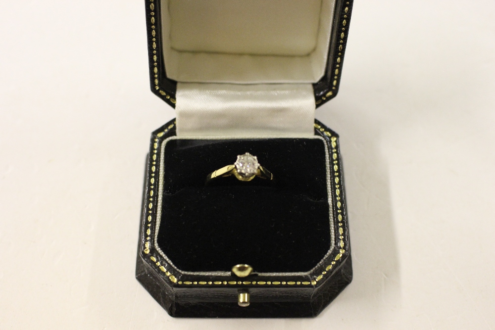 An 18ct gold solitaire diamond set ring