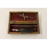 A surgeons mahogany and brass inlaid box containing scalpel