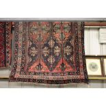 An approx. 63" x 93" Eastern red pattern rug